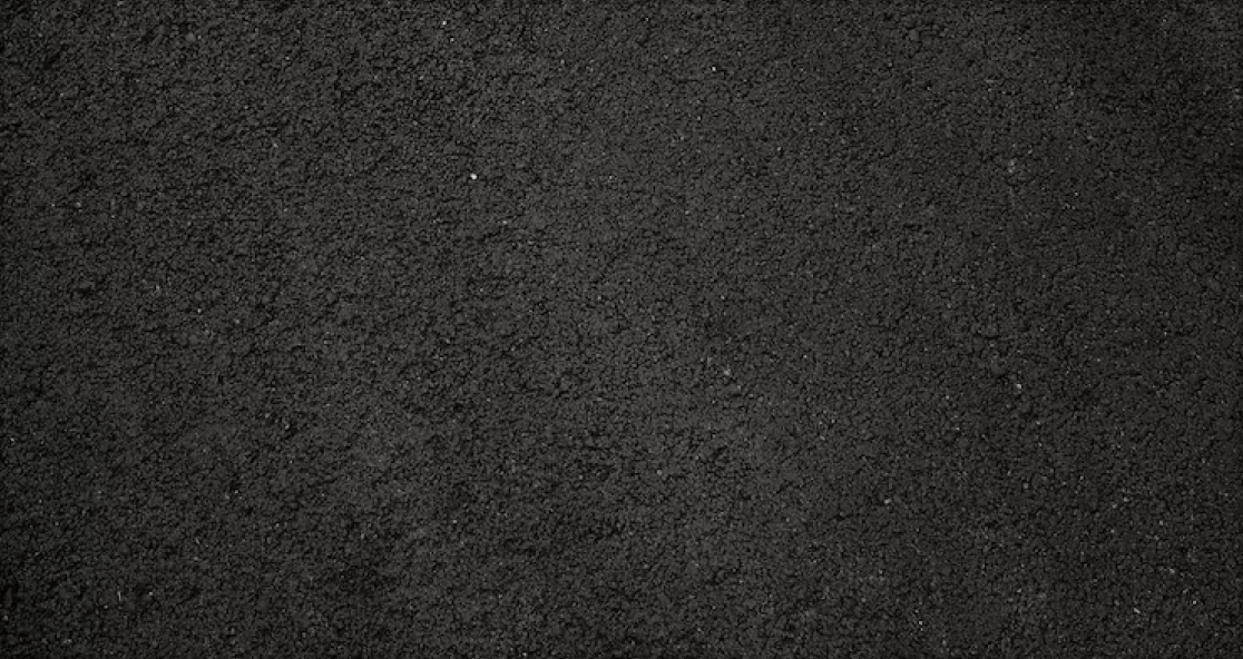 Close-up of fresh black asphalt surface