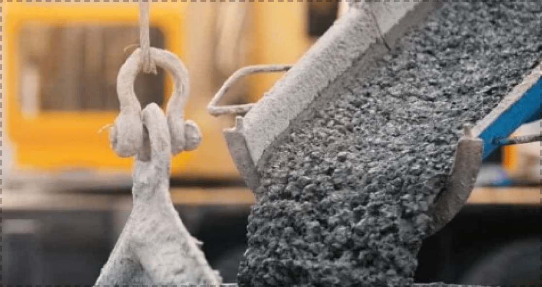Wet ready-mix concrete pouring from a chute
