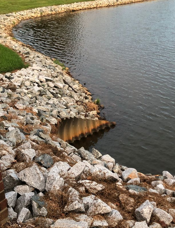 Rip rap lining the bank of a pond for erosion control