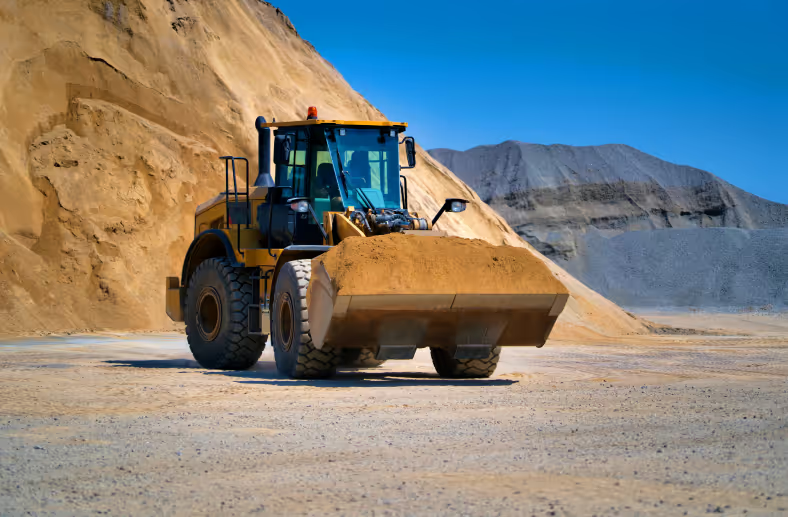 Wheel loader working a stockpile at a sand and gravel quarry